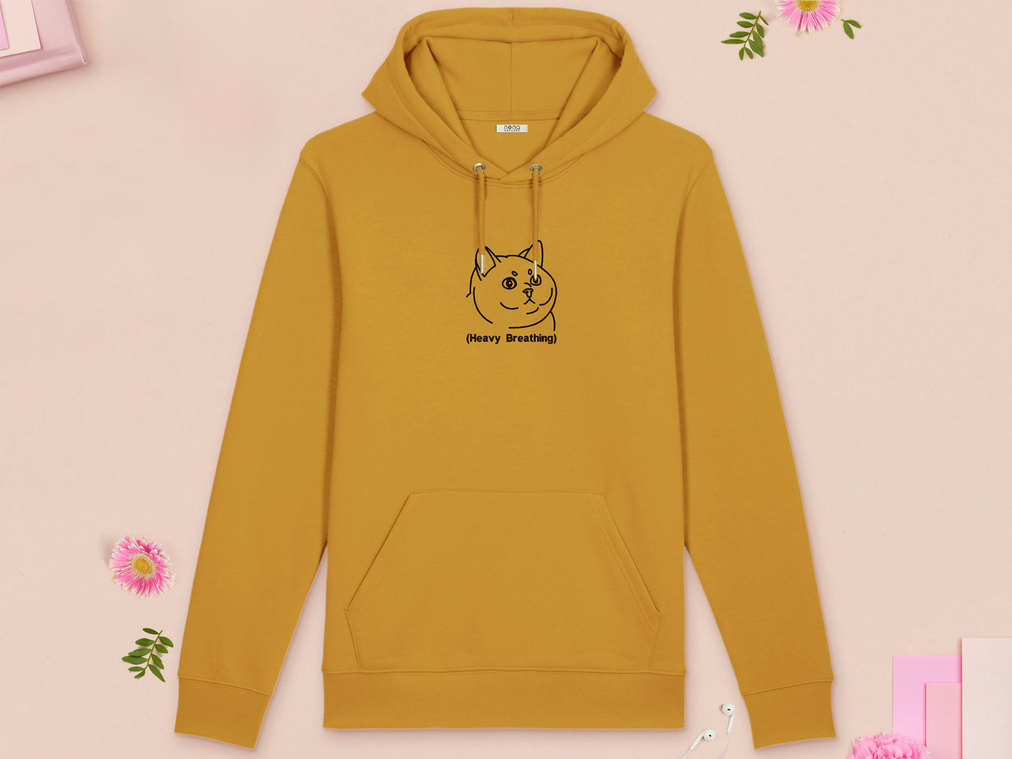 A yellow long sleeve fleece hoodie, with an embroidered black thread design of cute fat cat portrait with text underneath saying (Heavy Breathing)